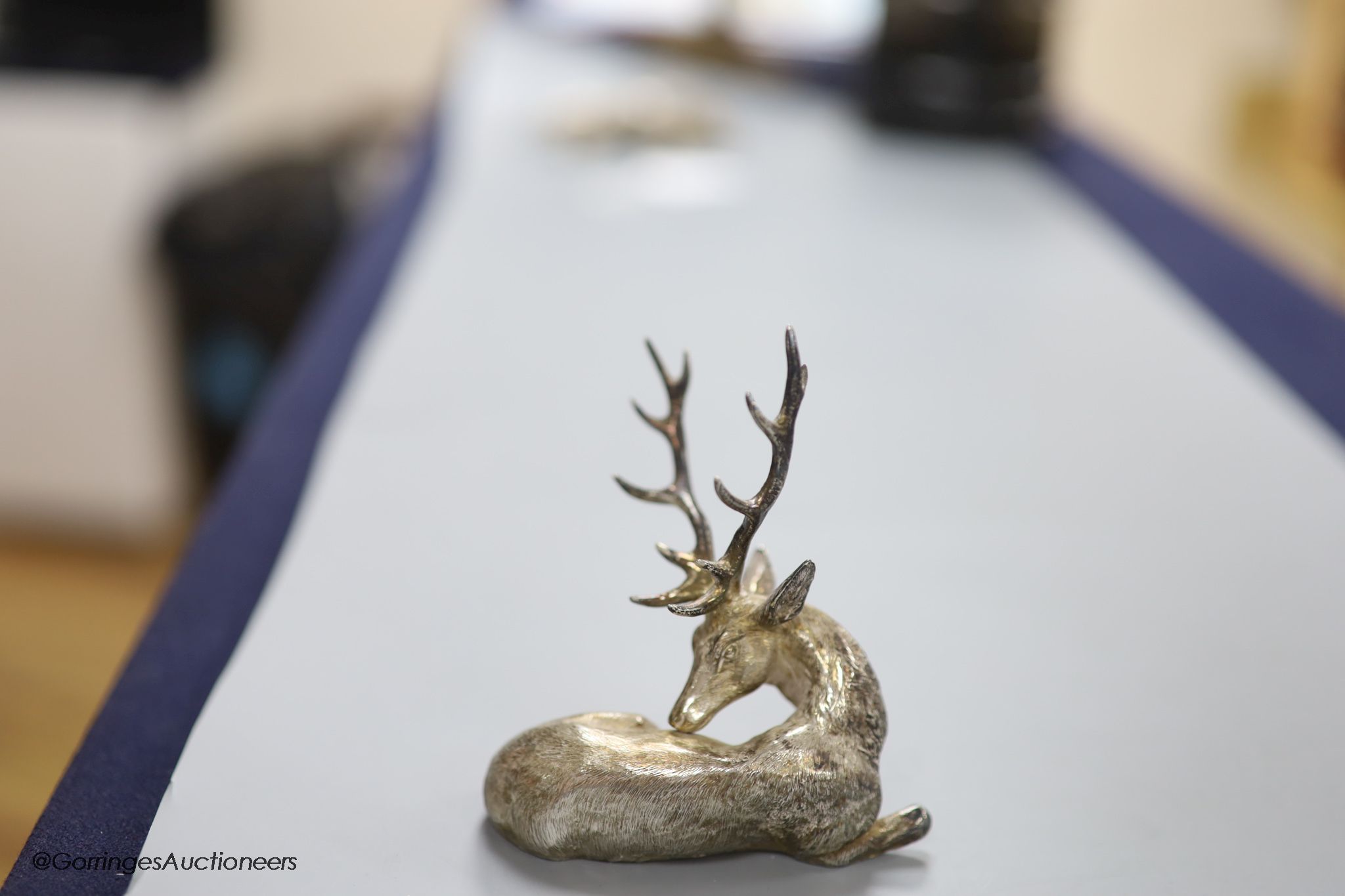 A modern silver miniature model of a recumbent stag C.F.H & Co, London, 1994, height 10.6cm, 170 grams.